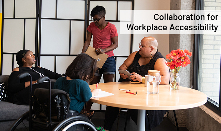 Four disabled women of color meeting around a table.